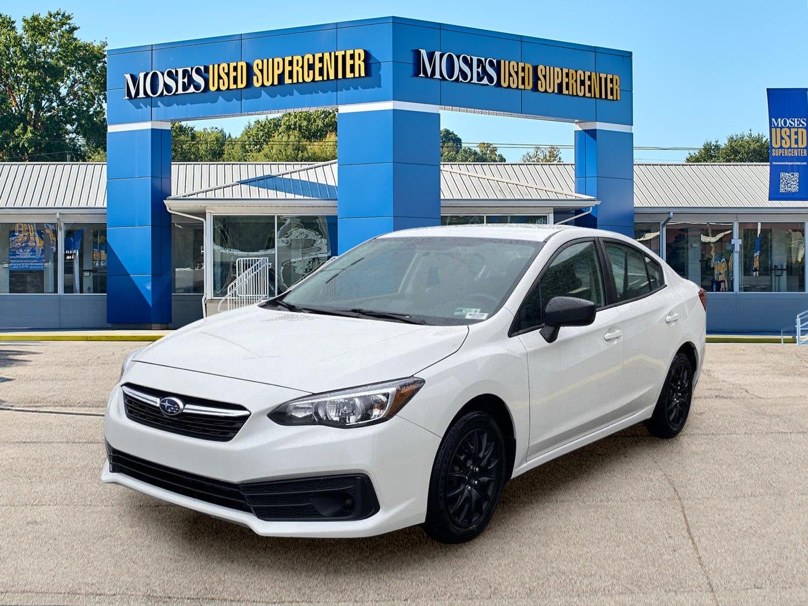 2023 Subaru Impreza 4-DOOR CVT in Crystal White Pearl — front three-quarter view
