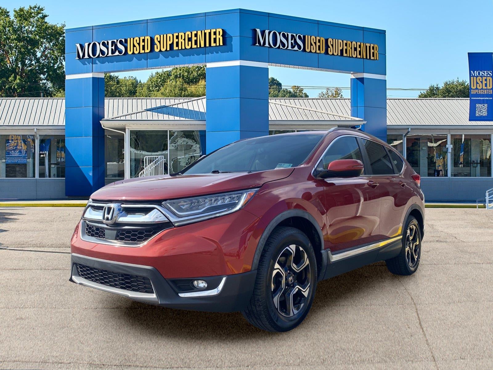 2017 Honda CR-V Touring in Molten Lava Pearl — front three-quarter view
