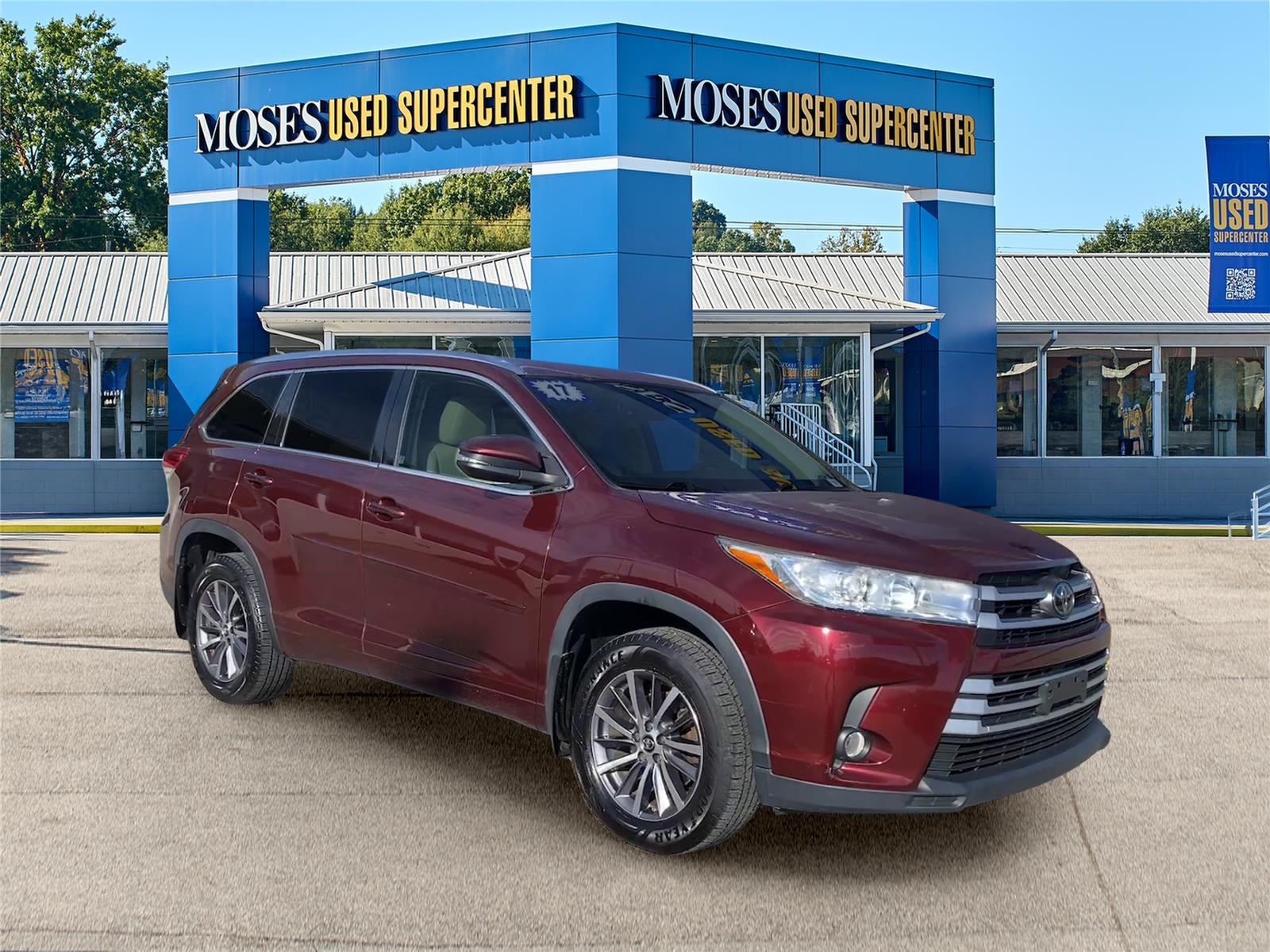 2017 Toyota Highlander XLE in Ooh La La Rouge Mica — front three-quarter view