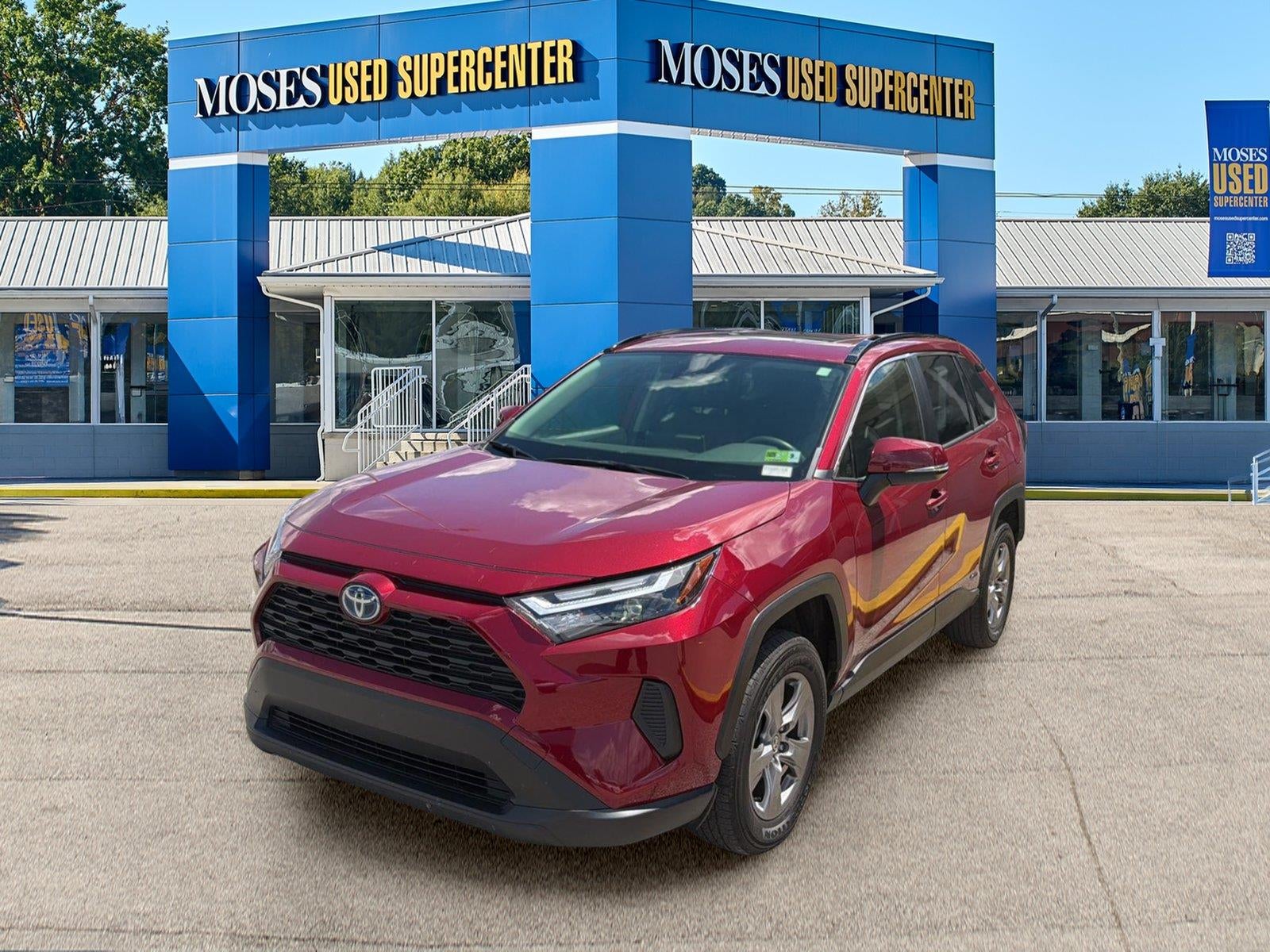 2024 Toyota RAV4 Hybrid XLE in Ruby Flare Pearl — front three-quarter view
